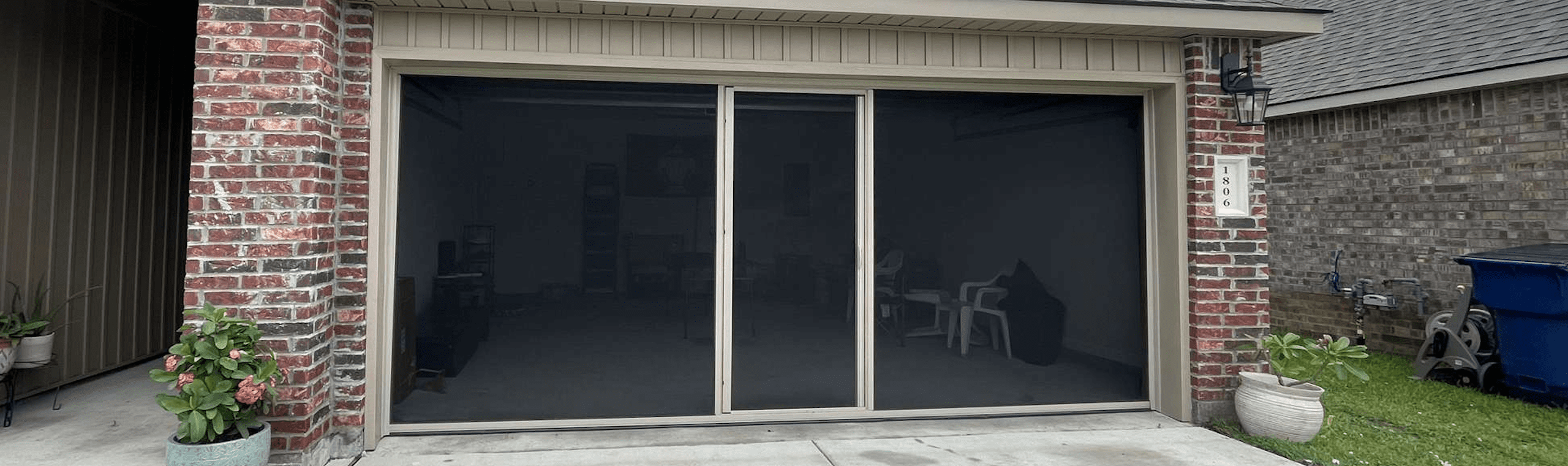 Garage screen door with walk-through access installed in Lafayette, LA.